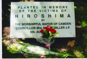 Hiroshima Memorial plaque under the cherry tree
